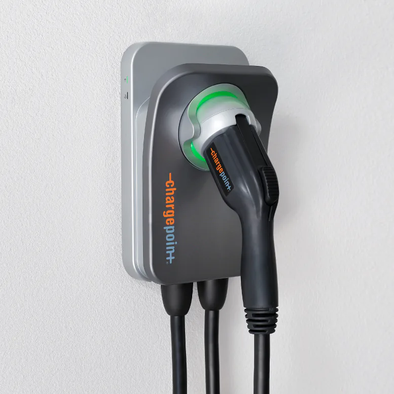 ChargePoint Home Flex wall unit with its J1772 connector holstered and the status ring lit green