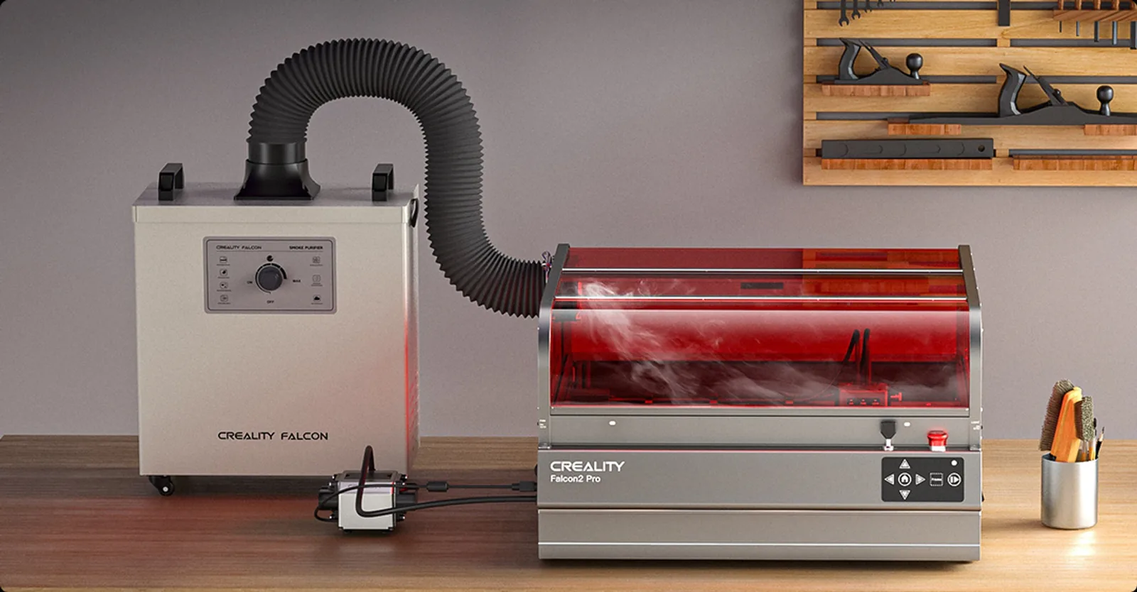 Falcon2 Pro venting through a corrugated exhaust hose into the optional Creality Falcon smoke purifier