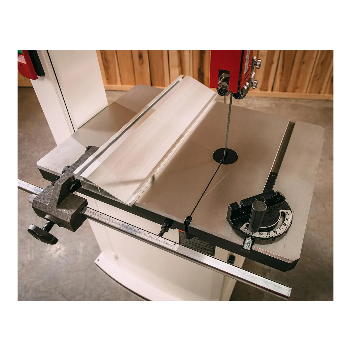 JET JWBS-15 bandsaw table with the resaw fence clamped to its scaled front rail and the miter gauge in the slot