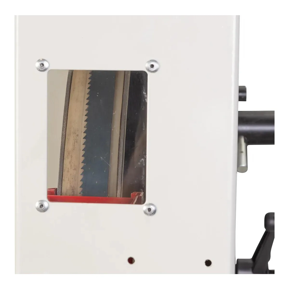 Blade tracking window in the upper wheel door of the JET JWBS-18SFX-3 bandsaw, with the blade visible riding on the tire