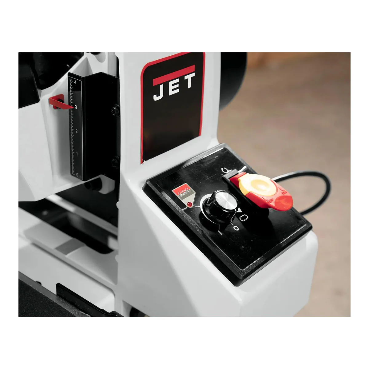 JET drum sander control panel with the SandSmart indicator light, conveyor speed knob, paddle switch and thickness scale