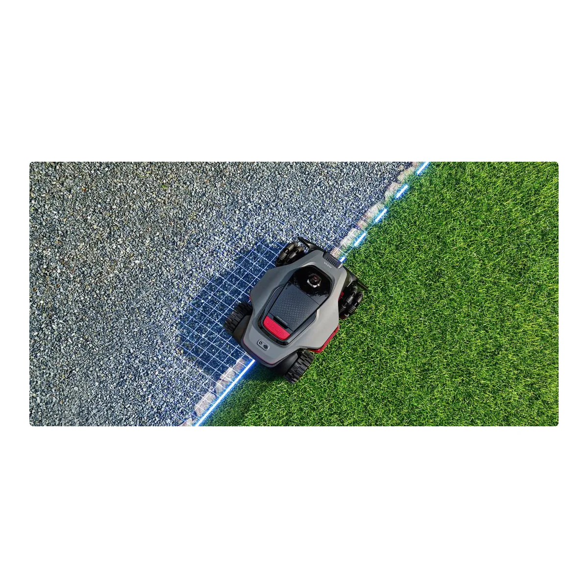 MOVA LiDAX Ultra 2000 AWD crossing from a gravel path onto grass along a wire-free virtual boundary