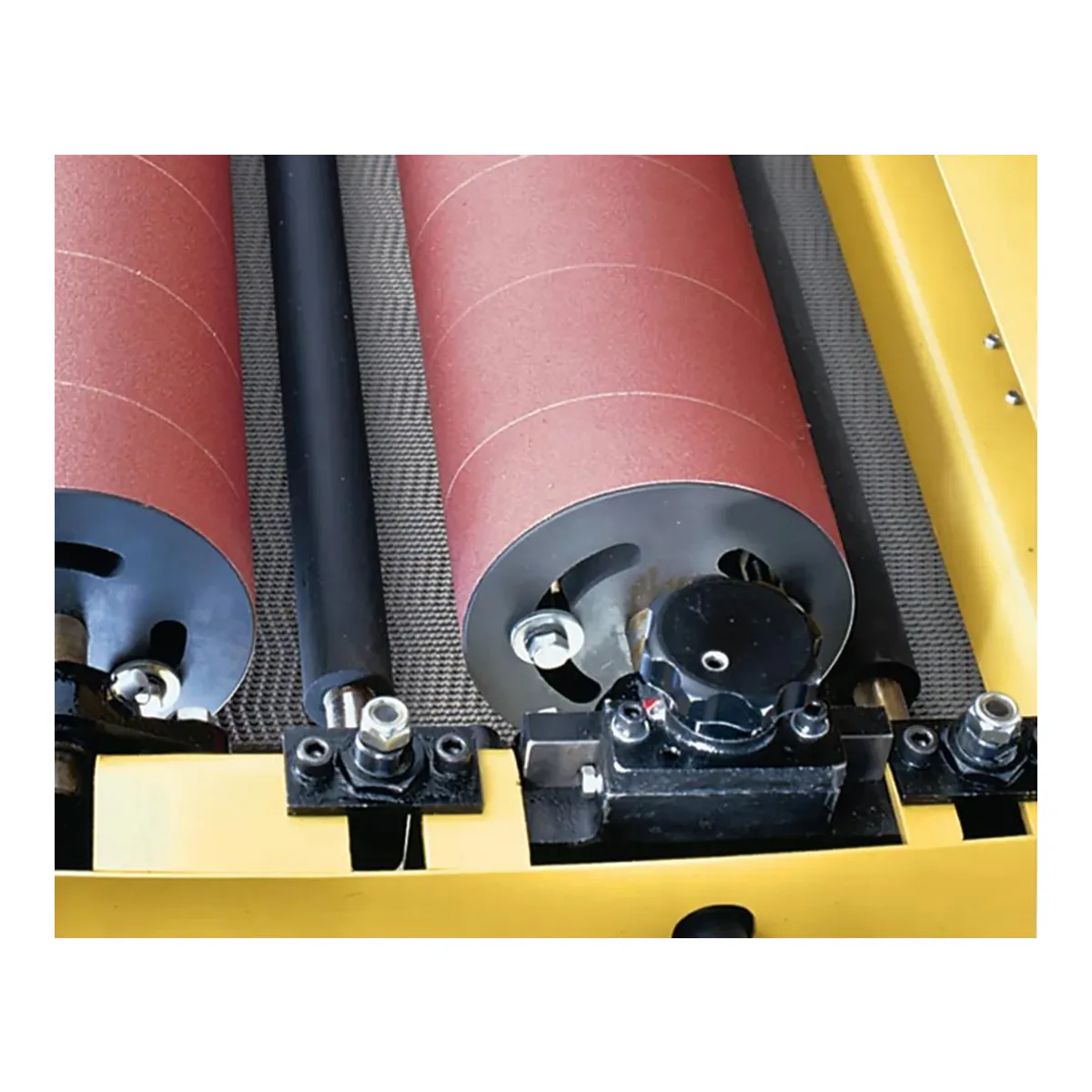 Powermatic DDS-225 dual drum sander, both abrasive-wrapped drums one behind the other over the mesh conveyor