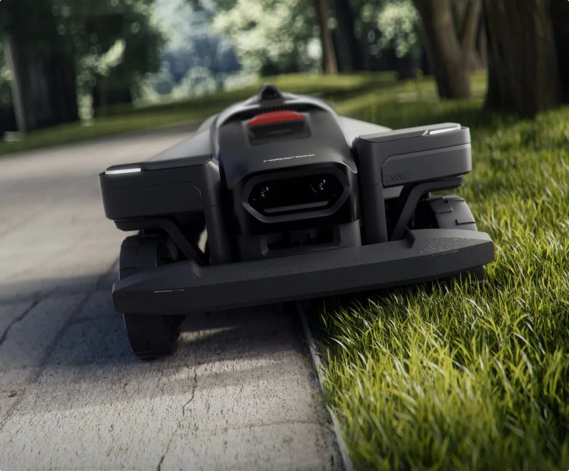 roborock RockMow X120H LiDAR driving along a sidewalk with one side of the deck riding over the lawn edge